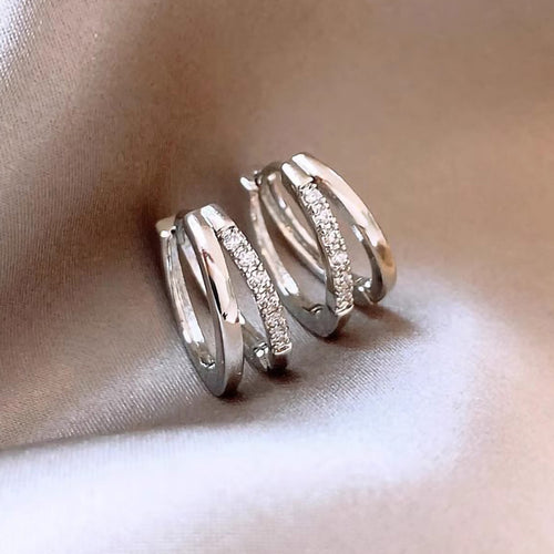 Front pair of white gold double-layer open hoop pave earrings