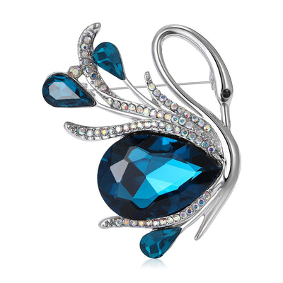 Front view of a silver-tone swan wrapped around a large faceted teardrop stone