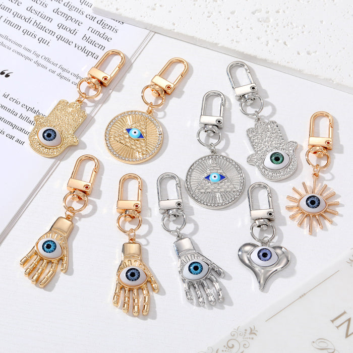 Gold and Silver Tone Geometric Hamsa and Eye Clip Keychains