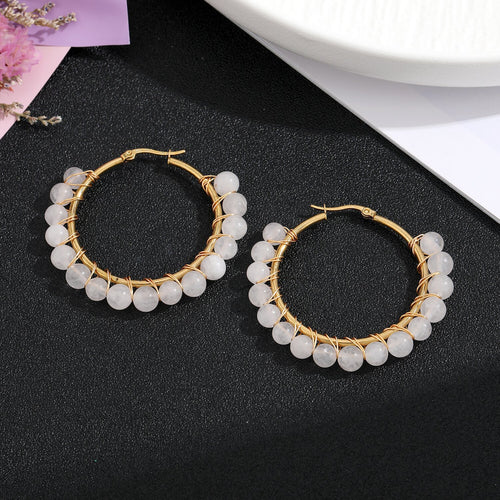 Close-up showing the colors and surface details of gold Tone Large Hoop Earrings with Irregular Chip Beads