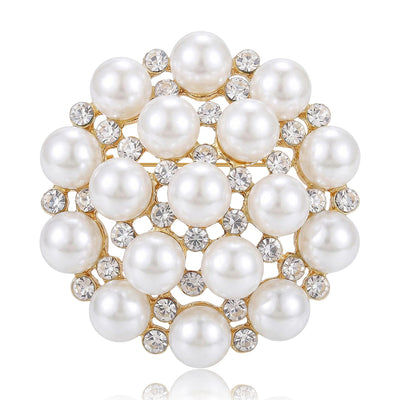 Front view of a round snowflake-like cluster of white pearls and clear stones