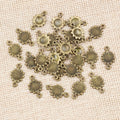 Double Loop Sunflower Connector Charms in Antique Bronze view 4