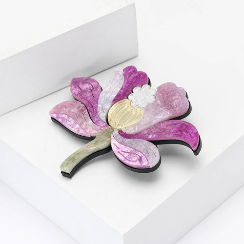 Purple glitter lotus brooch angled view showing layered acrylic thickness