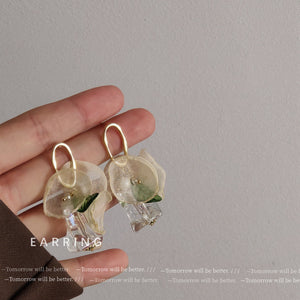 Gold Tone Oval Loop White Flower Green Leaf Iridescent Drop Earrings