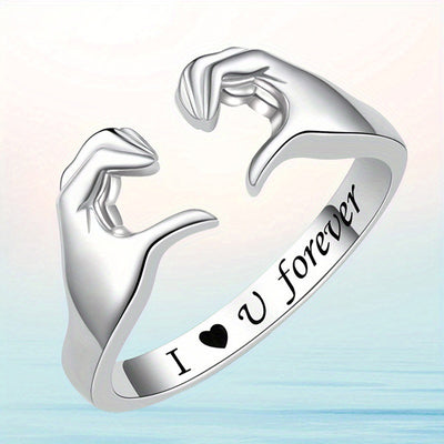 Angled silver heart hands open adjustable ring beach light