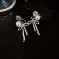 Butterfly and Bow Pearl Ear Cuffs in Two Silver Tone Styles view 6