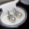 Silver Crystal and Pearl Huggie Earrings with Floral Accents view 4