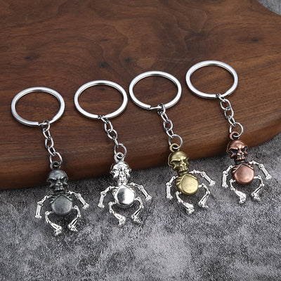 Four skeleton keychains in mixed antique finishes