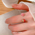 Gold Open Rings With Red Strawberry And Enamel Flower Ends view 3