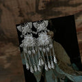 Silver Butterfly Floral Tassel Hook Earrings with Polished Metal Details view 3