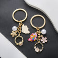 Pink Butterfly Pearl and Open Flower Enamel Charm Keychain view 2