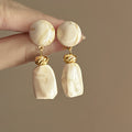 Marbled Geometric Resin Drop Earrings in Brown and Cream view 7