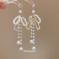 Bow and Pearl Like Bead Tassel Earrings in Gold Tone view 4
