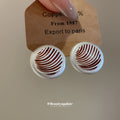 Striped Round Stud Earrings in Silver and Gold with Polished Details view 4