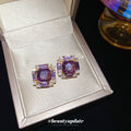 Gold Tone Square Stud Earrings with Purple Crystal Centers view 2