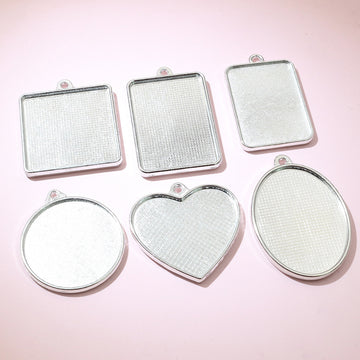 Glass Cabochons and Metal Pendant Trays in Twelve Shapes and Sizes