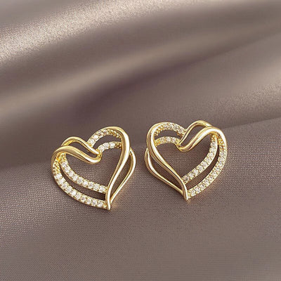 Alternate frontal view of gold double heart crystal pave studs