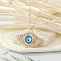 Gold Tone Blue Evil Eye and Hamsa Hand Pendant Necklaces view 5