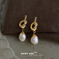 Gold Tone Sculpted Knot Irregular White Pearl Drop Earrings view 4