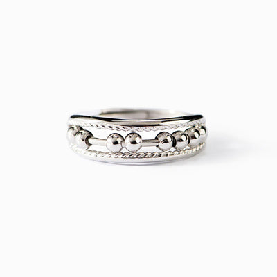 Studio front view of silver movable bead abacus band ring on white
