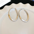 Slim Elongated Oval Hoop Earrings in Gold and Silver Tones view 7