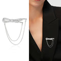 Crystal Bow Chain Brooch In Gold Or Silver Tone With Polished Metal Detail view 2