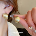 Brushed Curved Stud Earrings in Three Metallic Finishes view 4
