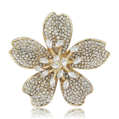 Front view of a five-petal blossom with textured pavé surfaces and a crystal center