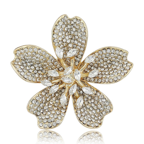 Front view of a five-petal blossom with textured pavé surfaces and a crystal center