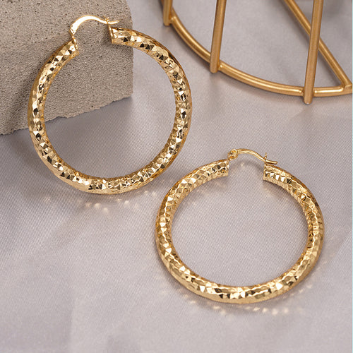 Second product view showing textured gold-tone hoop earrings