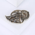 Gray Crystal Feather Brooch with Polished Metal and Decorative Accents view 3