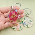 Silver Tone Round Pressed Flower Resin Clip Keychains in Five Designs view 4