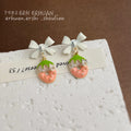 White Bow Strawberry Enamel Drop Earrings Gold Seed Accents view 4