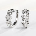 Silver Flower Huggie Hoop Earrings Clear CZ Accents view 6