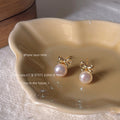 Gold Tone Bow And White Pearlescent Drop Stud Earrings view 4