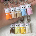 Flocked White Cat Clip Keychains in Nine Outfit Colors view 4
