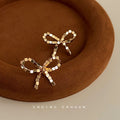 Gold 3D Cube Segment Bow Stud Earrings Geometric Pair view 3