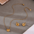 Open Heart Necklace and Hoop Earring Collection in Mixed Metal Finishes view 3