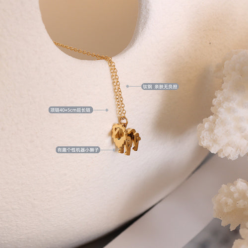 Gold mechanical lion charm close-up with size material labels on soft props