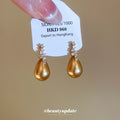 Gold Tone Crystal Teardrop Stud Earrings With Layered Frames view 3