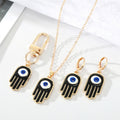 Gold Tone Black Enamel Hamsa Eye Jewelry and Keychain Options view 1