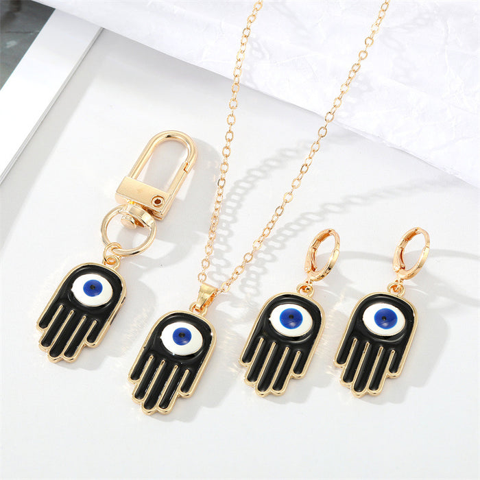 Gold Tone Black Enamel Hamsa Eye Jewelry and Keychain Options