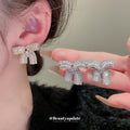 Silver Crystal Pave Ribbon Bow Statement Stud Earrings view 2