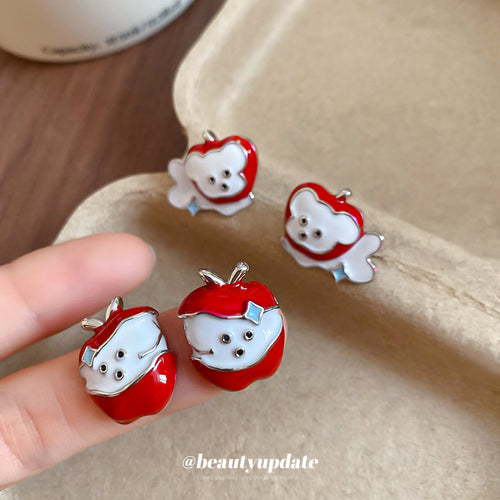 Display view of red apple and white dog enamel character stud earrings