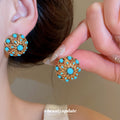 Gold Tone Turquoise Stone Floral Openwork Stud Earrings view 2