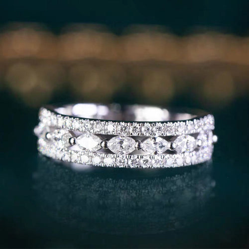 Front view of marquise center triple-row pave band ring