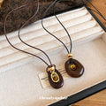 Brown Oval Layered Pendant Necklace On Black Cord Pendant Jewelry view 2