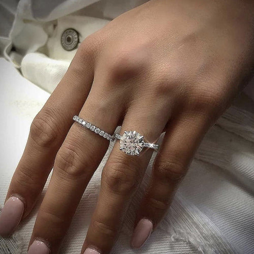 Round clear center ring worn beside the matching band
