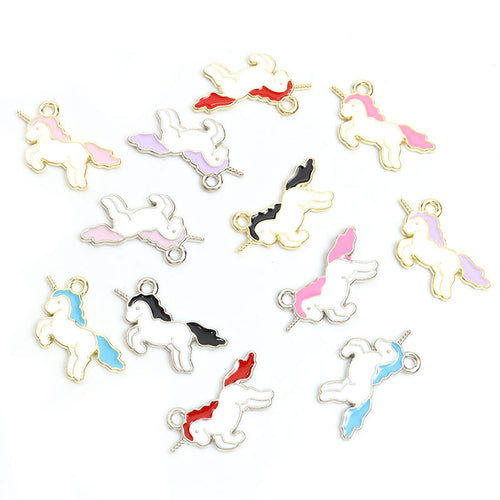 Silver-tone and gold-tone unicorn charms arranged to show six mane and tail colors