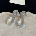 Clear Flower and Teardrop Silver Tone Statement Earrings view 1